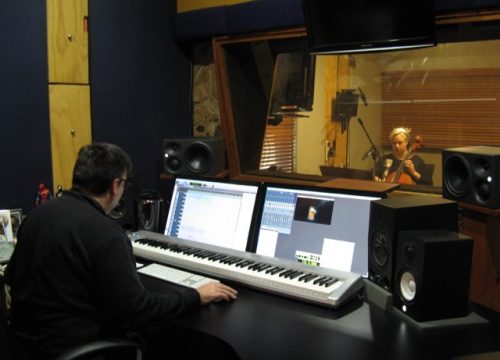 Amicus Strings Jacqui recording a television commercial with mixing guy